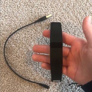 black fitbit with charger